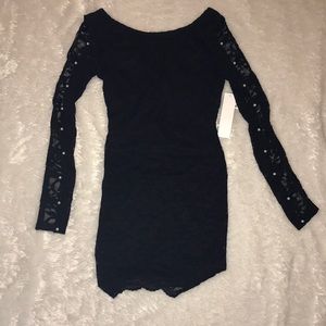 Black lace dress with pear details.